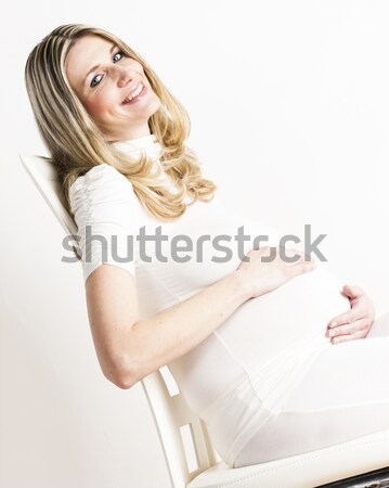 Stock photo: portrait of relaxing pregnant woman wearing white clothes