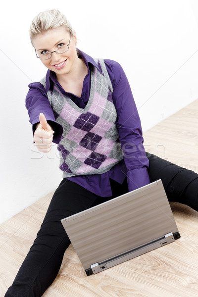 sitting young businesswoman with a notebook Stock photo © phbcz