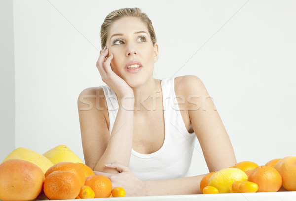 portrait of young woman with citrus fruit Stock photo © phbcz