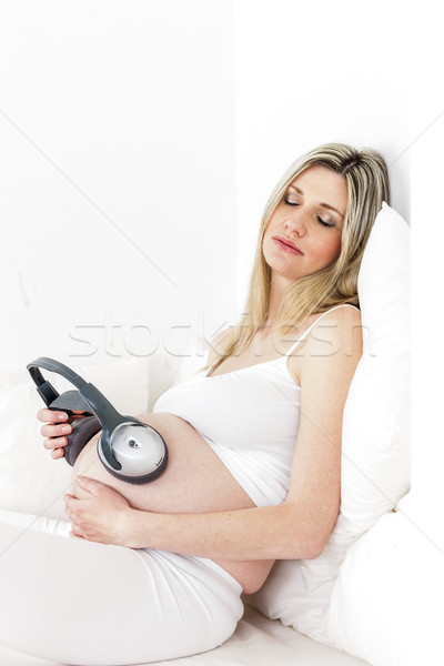 Foto stock: Mujer · embarazada · auriculares · cama · mujer · retrato