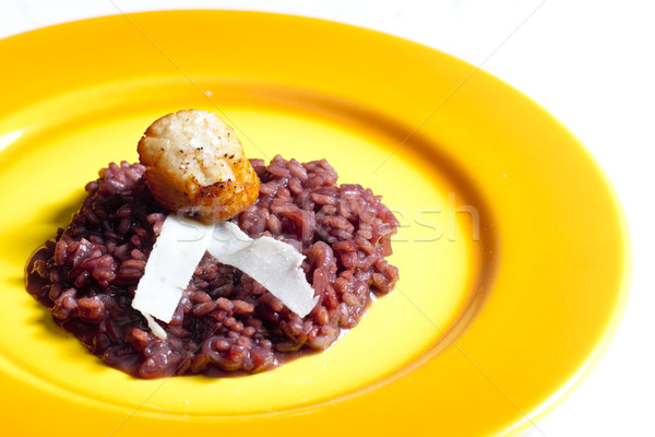 fried Saint Jacques mollusc on risotto steamed with red wine Stock photo © phbcz