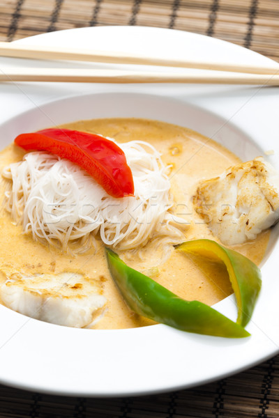 Thai curry with cod and rice noodles Stock photo © phbcz