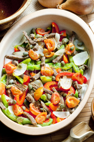 beef meat with peppers, onion and capers Stock photo © phbcz