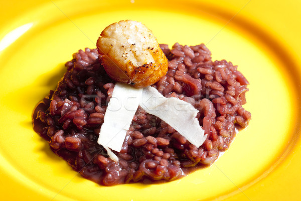 fried Saint Jacques mollusc on risotto steamed with red wine Stock photo © phbcz