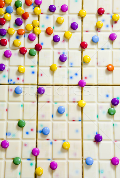 still life of white chocolate with smarties Stock photo © phbcz