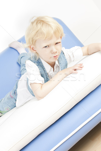 little girl lying on sofa Stock photo © phbcz