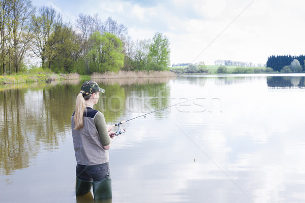 Mulher pescaria lagoa primavera mulheres paisagem Foto stock © phbcz