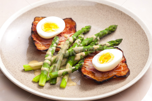 boiled green asparagus with bacon, egg and mustard dip Stock photo © phbcz