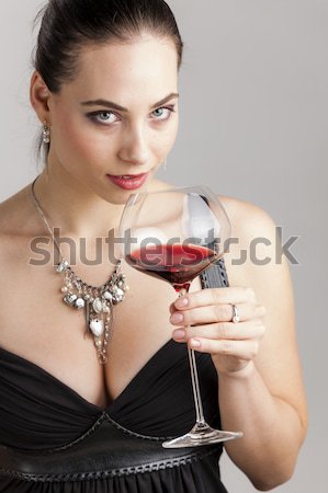portrait of young woman with a glass of red wine Stock photo © phbcz
