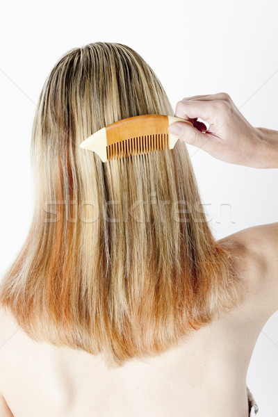 detail of woman combing long hair Stock photo © phbcz