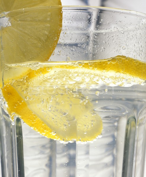 lemon in the glass of water Stock photo © phbcz