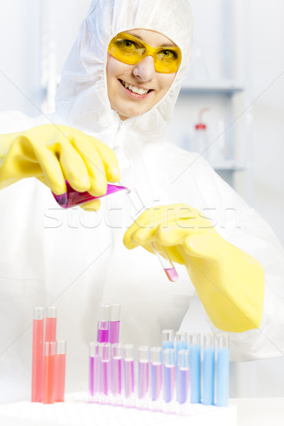 young woman wearing protective coat in laboratory Stock photo © phbcz