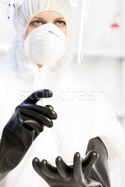 young woman wearing protective clothes in laboratory Stock photo © phbcz