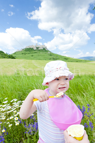 portrait of eating little girl Stock photo © phbcz