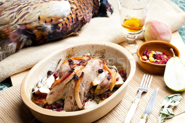 baked pheasant with bacon, pear, raisins on brandy Stock photo © phbcz