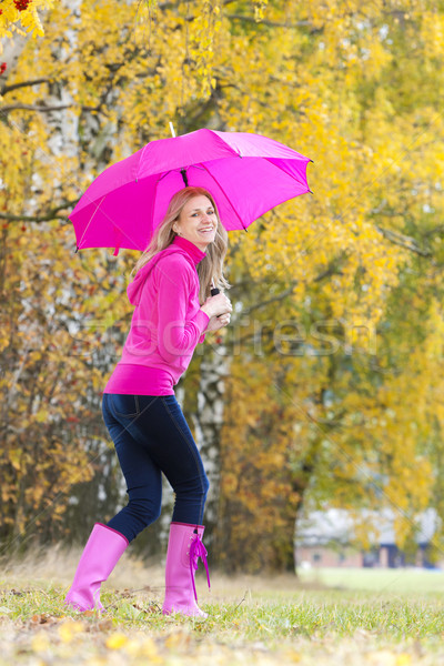 woman wearing rubber boots with umbrella in autumnal nature Stock photo © phbcz