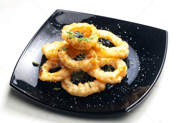 fried cuttlefish rings in batter Stock photo © phbcz