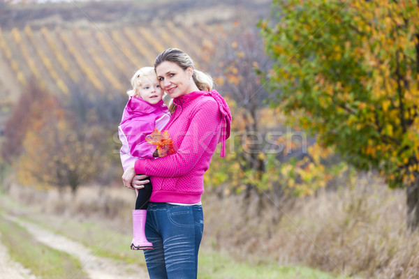 Stock photo: mother with her daughter in autumnal nature