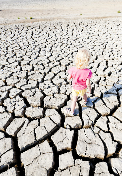 little girl standing on dry land, Parc Regional de Camargue, Pro Stock photo © phbcz