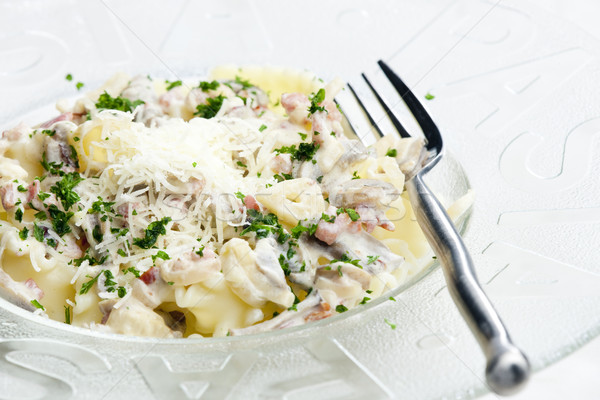 pasta with ham and champignons on white wine Stock photo © phbcz