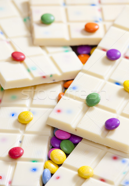 still life of white chocolate with smarties Stock photo © phbcz