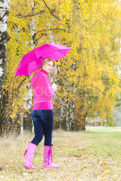 woman wearing rubber boots with umbrella in autumnal nature Stock photo © phbcz