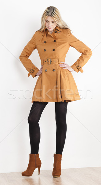 standing woman wearing coat and fashionable brown shoes Stock photo © phbcz