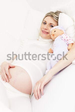 little girl and her pregnant mother with clothes and shoes for a Stock photo © phbcz