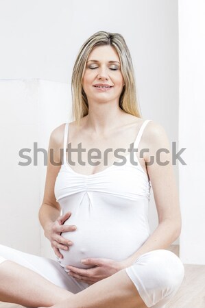 portrait of standing pregnant woman wearing lingerie Stock photo © phbcz