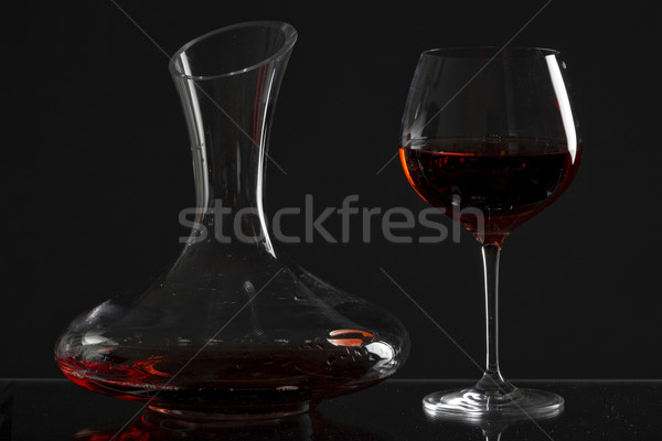 wine glass and carafe with red wine Stock photo © phbcz