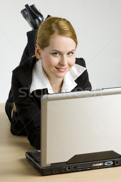 lying businesswoman with a notebook Stock photo © phbcz
