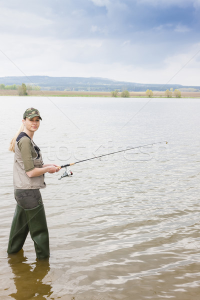 woman fishing in pond Stock photo © phbcz