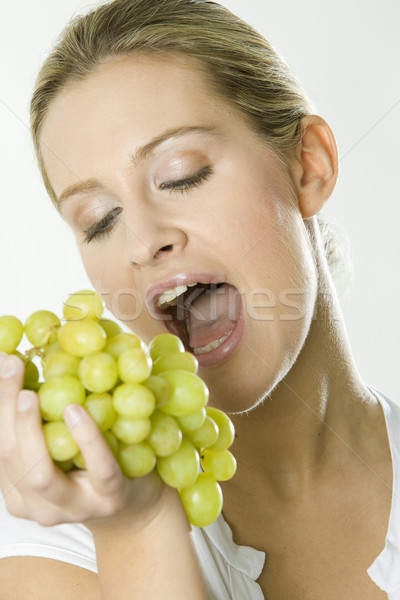 portrait of woman with grape Stock photo © phbcz