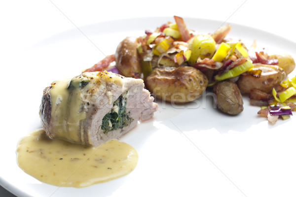 baked pork tenderloin filled with spinach and goat cheese on cre Stock photo © phbcz