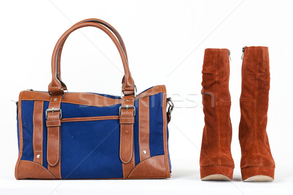 Stock photo: fashionable platform brown shoes with a denim handbag