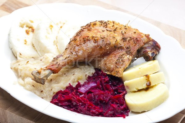 baked duck meat with dumlings and cabbage Stock photo © phbcz