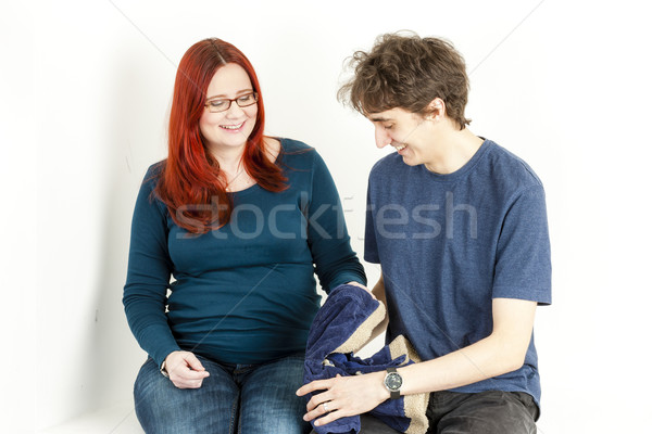 portrait of pregnant woman and her husband with clothes for a ba Stock photo © phbcz