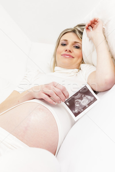 Terhes nő pihen ágy ultrahang baba nők Stock fotó © phbcz