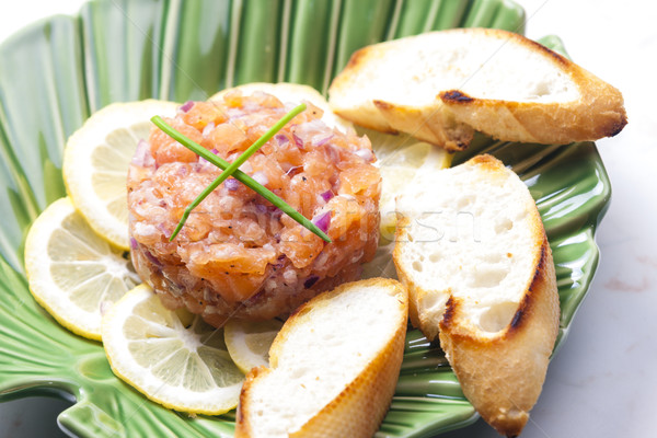 salmon tartar with red onion Stock photo © phbcz
