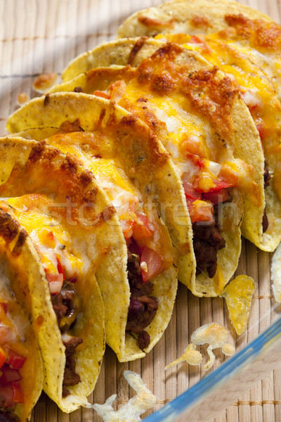 baked tacos with tomatoes and minced meat Stock photo © phbcz