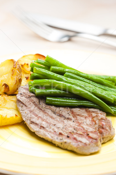 beefsteak with green beans and garlic potatoes Stock photo © phbcz