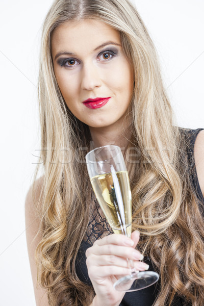 portrait of young woman with a glass of champagne Stock photo © phbcz