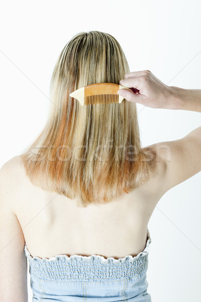 detail of woman combing long hair Stock photo © phbcz