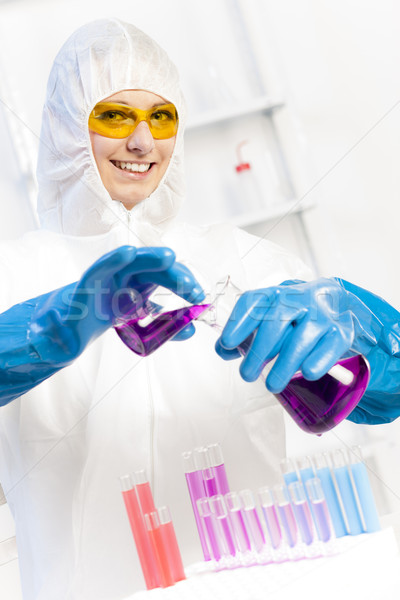 young woman wearing protective coat in laboratory Stock photo © phbcz