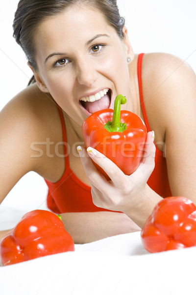 portrait of lying down woman with peppers Stock photo © phbcz