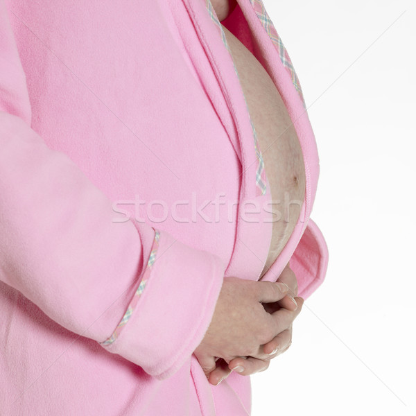 detail of pregnat woman wearing bath robe Stock photo © phbcz