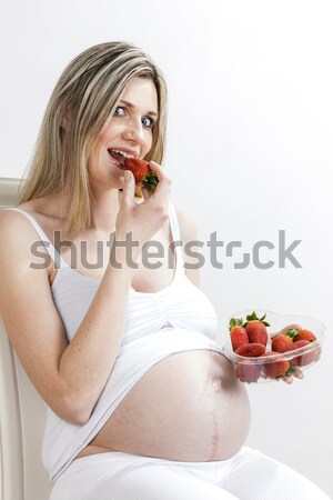 lying down woman eating salad Stock photo © phbcz