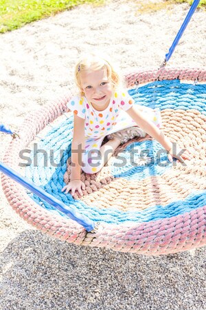 little girl with water sprayer by swimming pool Stock photo © phbcz