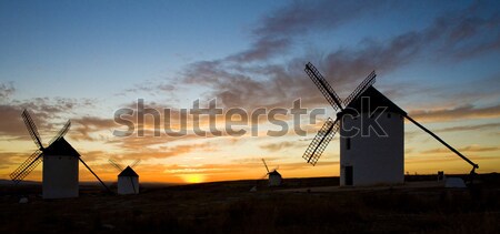 windmills at sunset, Campo de Criptana, Castile-La Mancha, Spain Stock photo © phbcz