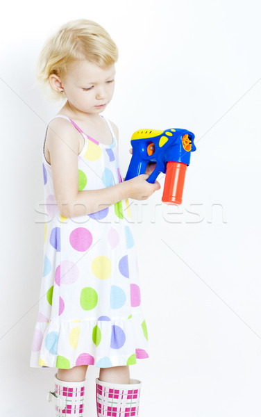 Stock photo: little girl with bubbles maker